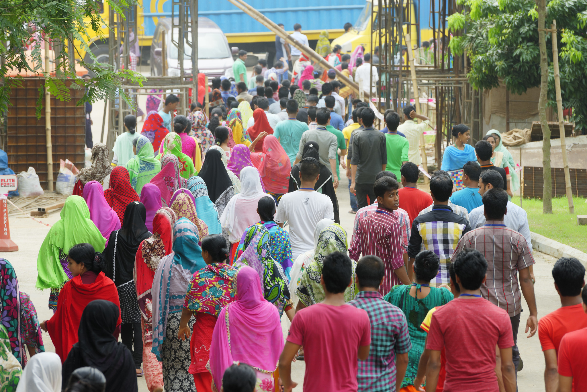 Bangladeshi garment employees are seen leaving a clothing plant at the end of their working day.