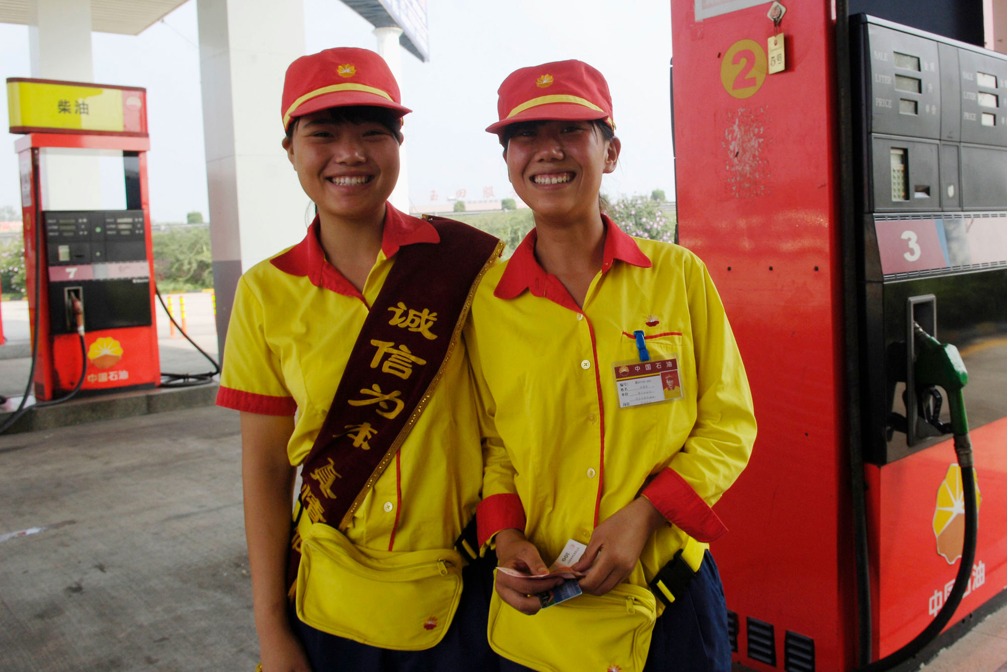 image of two petrol workers on petrol court