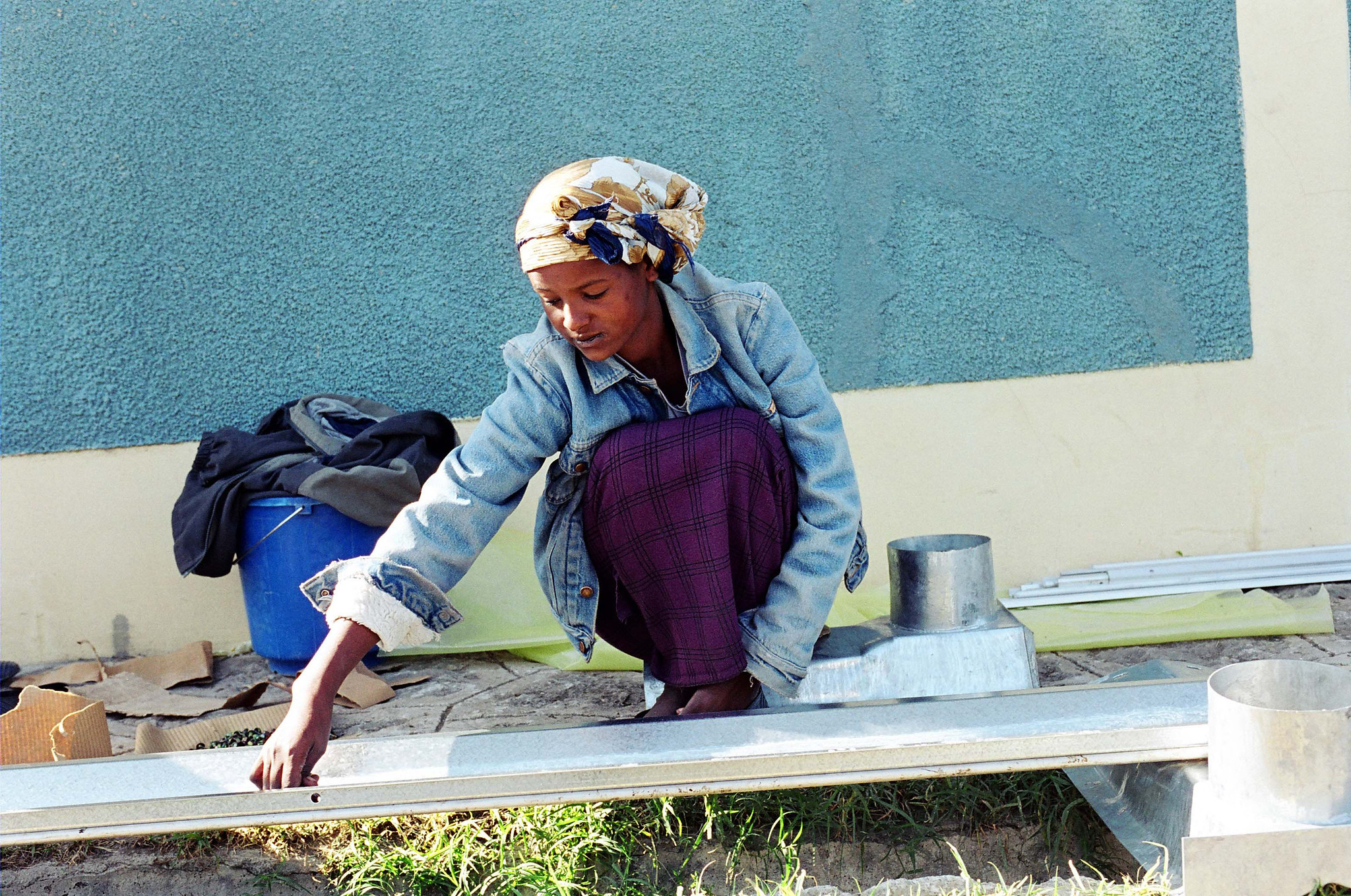 Woman building a greenhouse in the suburbs of Addis Ababa, Ethiopia