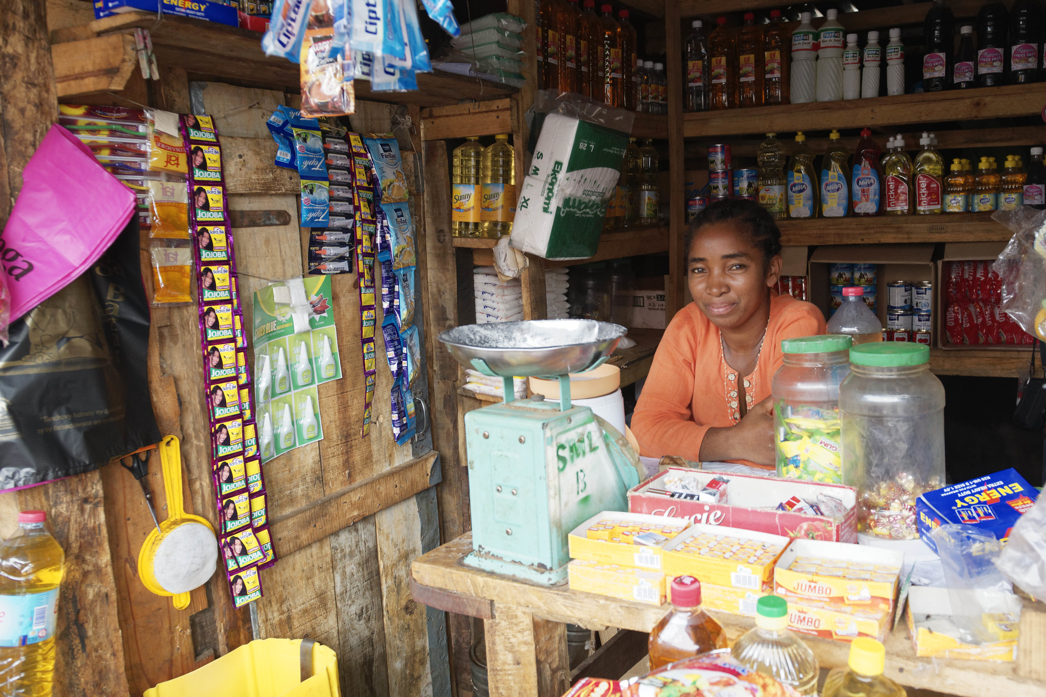 Lady shop attendant in street shop in Madagascar