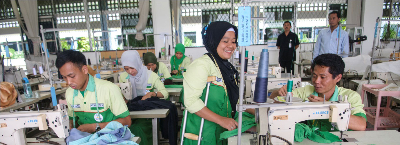 Disabled woman working in a garment factory in Asia