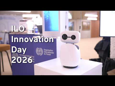 Innovation day poster in the backgroud with robot infront