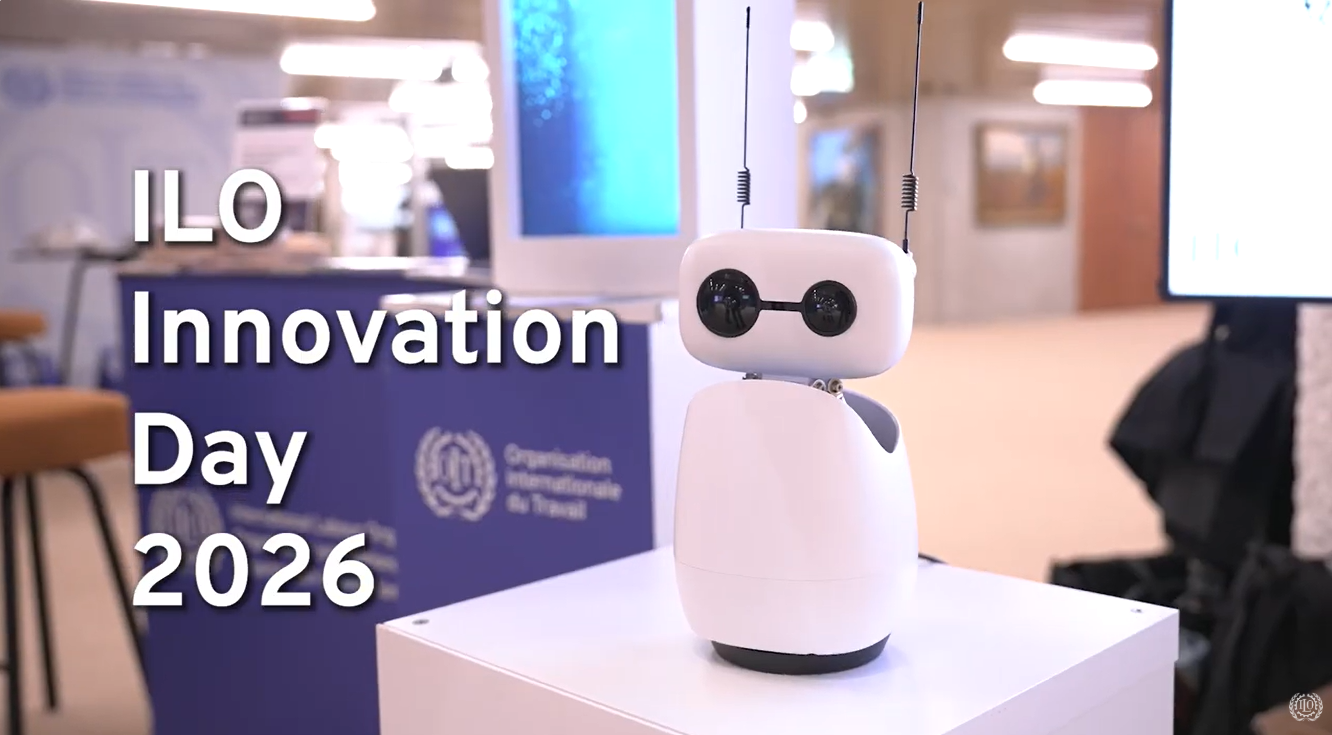 Innovation day poster in the backgroud with robot infront