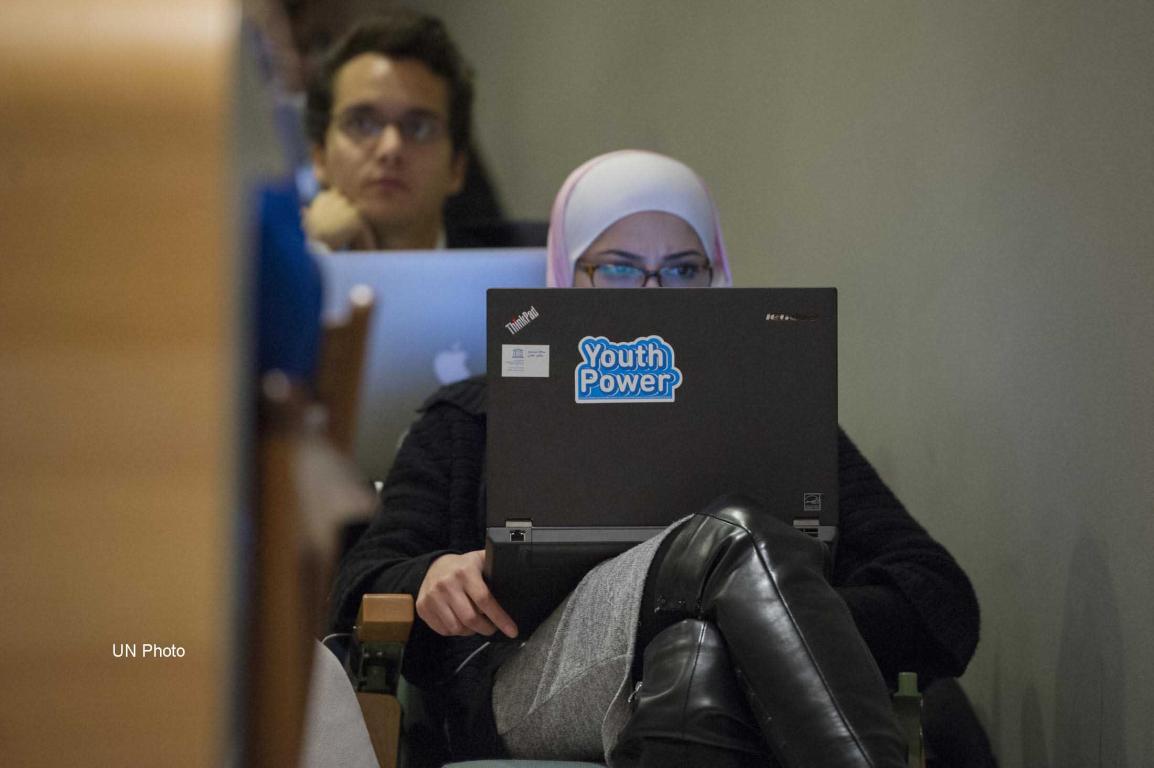 Woman looks at her computer screen