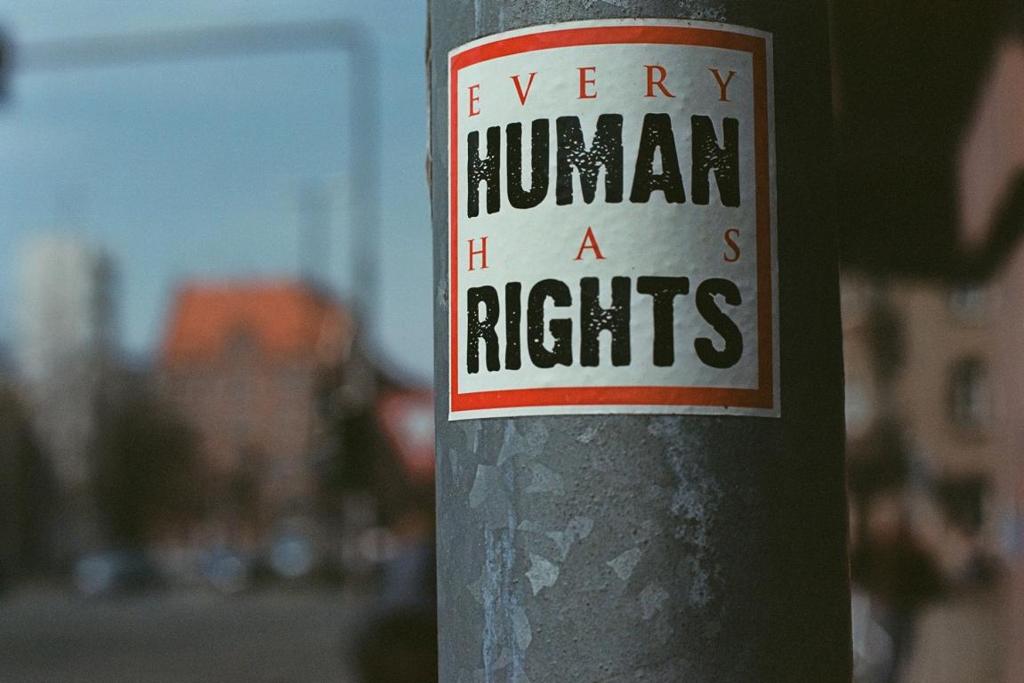 black and white label on pipe with "Every human has rights" written