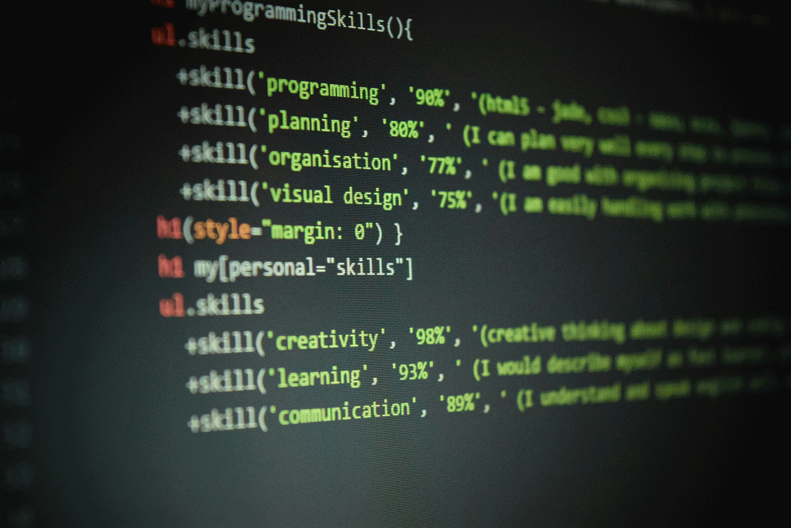 screen with computer coding in yellow white and red text