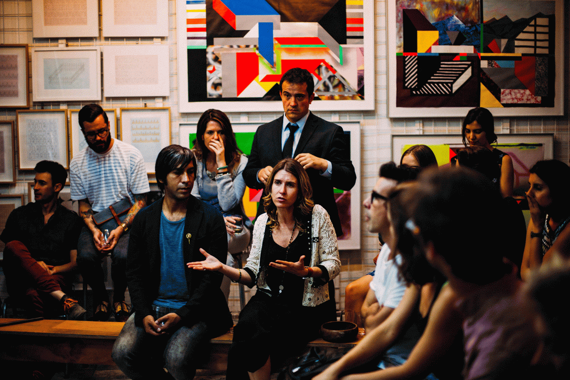 group of people in a meeting sitting on tables