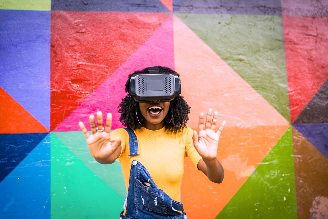 A young African woman wears a virtual reality headset