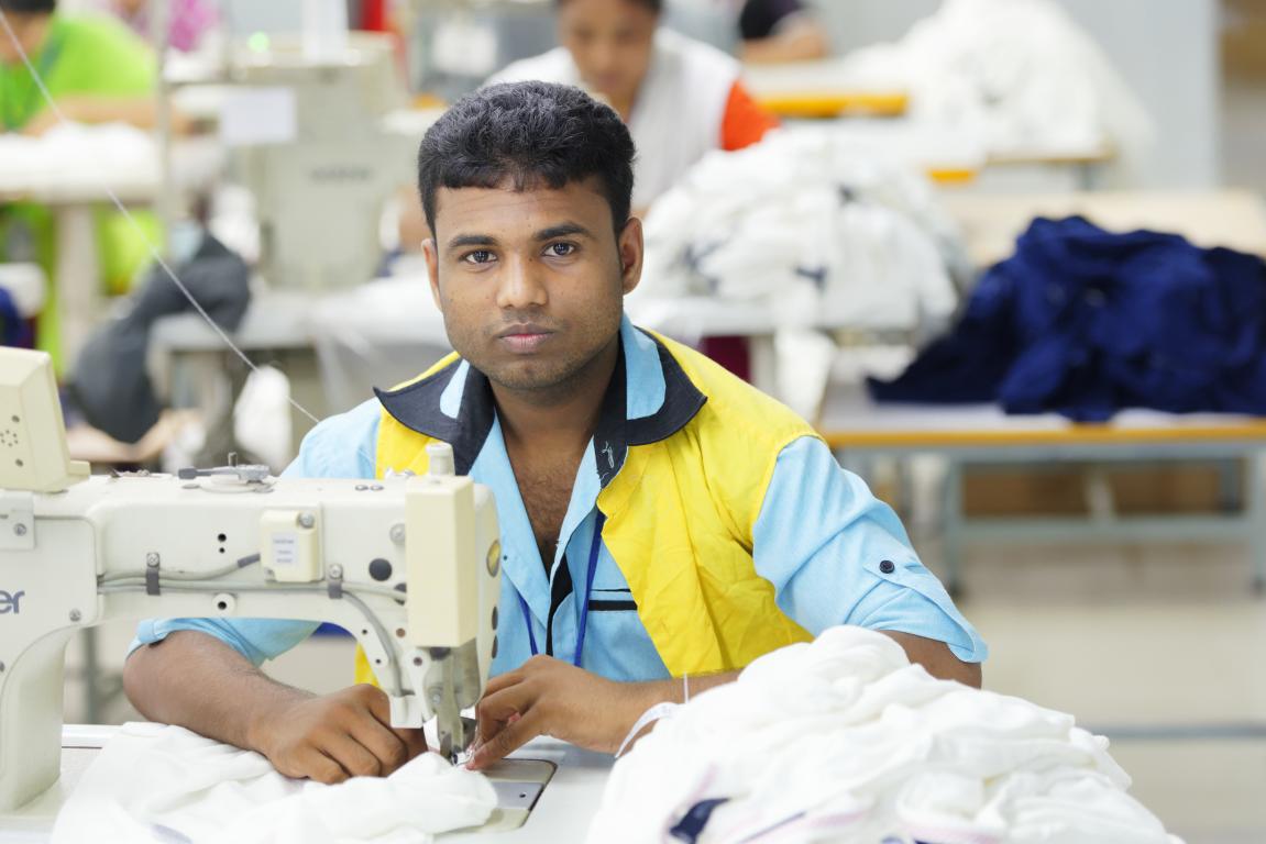 Man working in a garment factory in Bangladesh