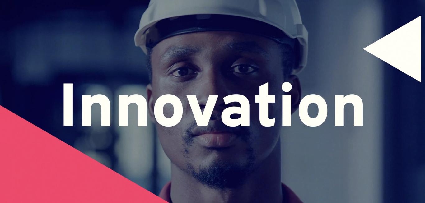 A man in a hard hard with the word Innovation