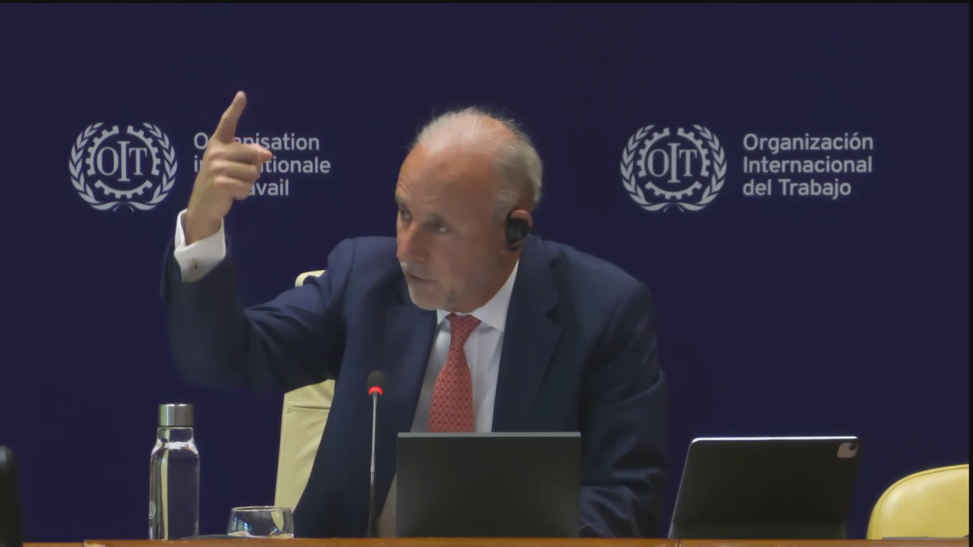 Javier González-Olaechea Franco gestures as he speaks in front of an ILO backdrop