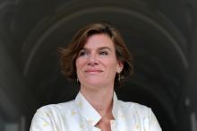 Shouldershot of smiling lady with short brown hair, wearing white shirt - Mariana Mazzucato - copyright Tania Cristofari