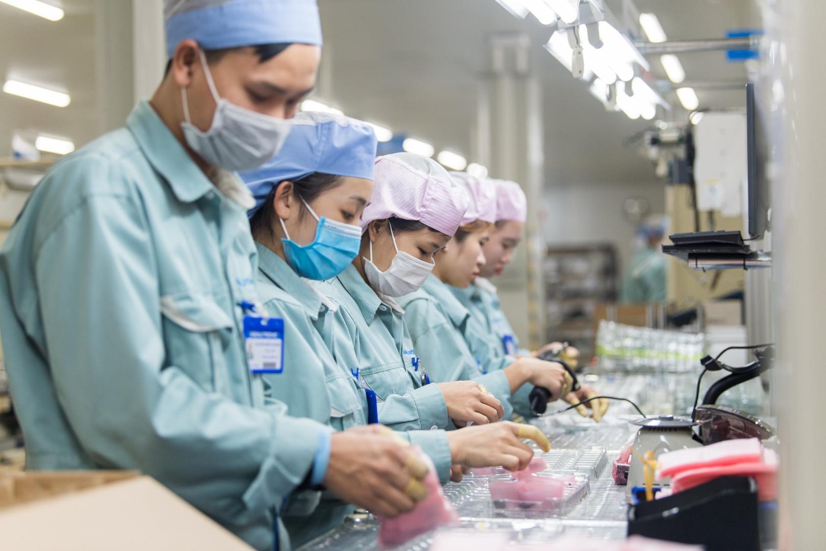  Workers check electronic components at a factory in Bac Ninh Province, Viet Nam in December 2021. © ILO